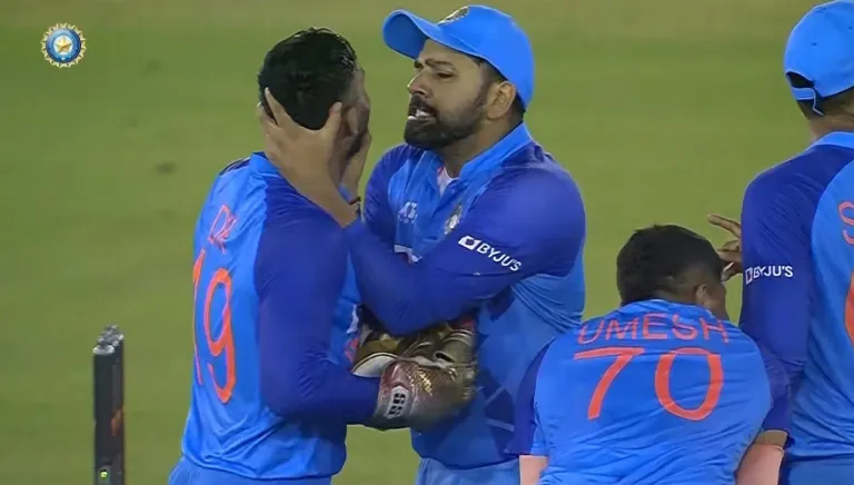 Rohit Sharma playfully grabbing Dinesh Karthik