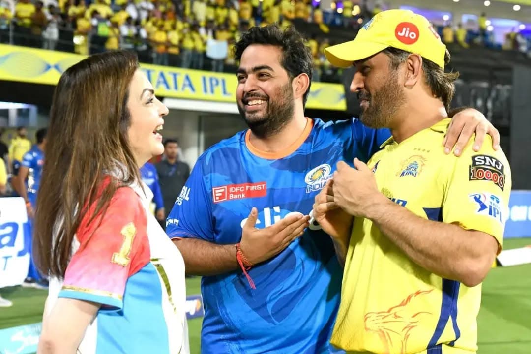 Nita Ambani, Akash Ambani, and MS Dhoni sharing a light moment