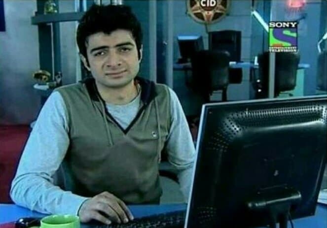 CID Vivek looking at the camera